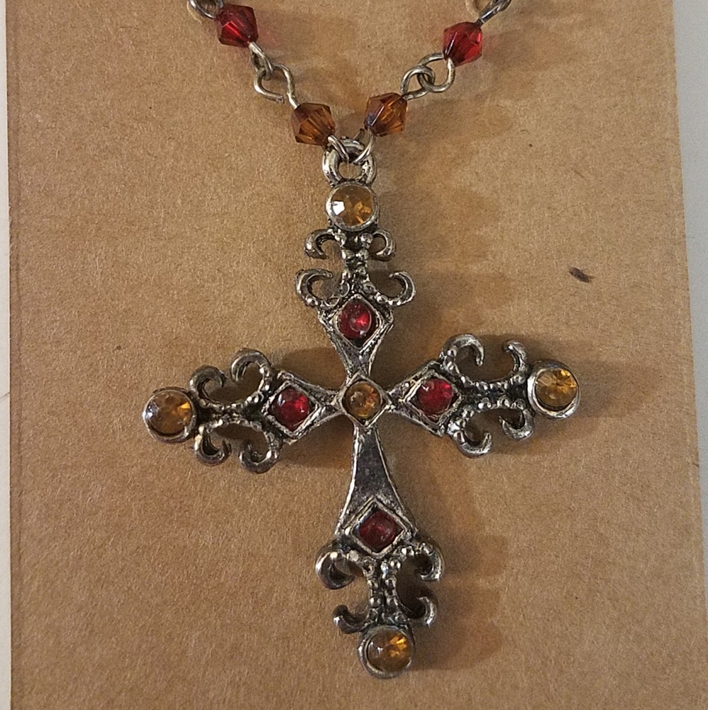 Pretty jeweled cross necklace.